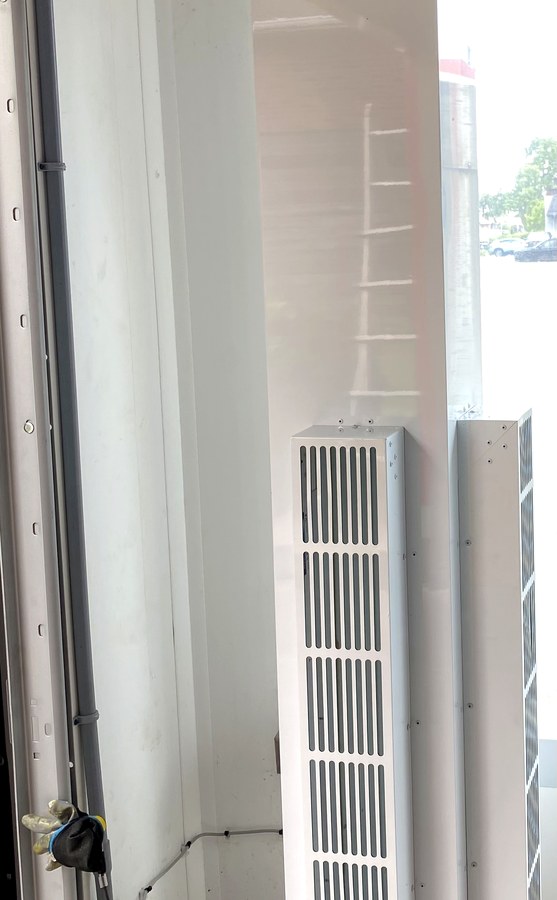 New air curtain unit heaters installed at a Hamilton commercial car wash bay entrance
