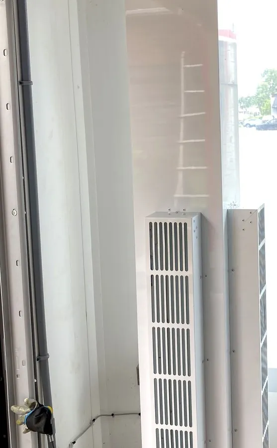 New air curtain unit heaters installed at a Hamilton commercial car wash bay entrance